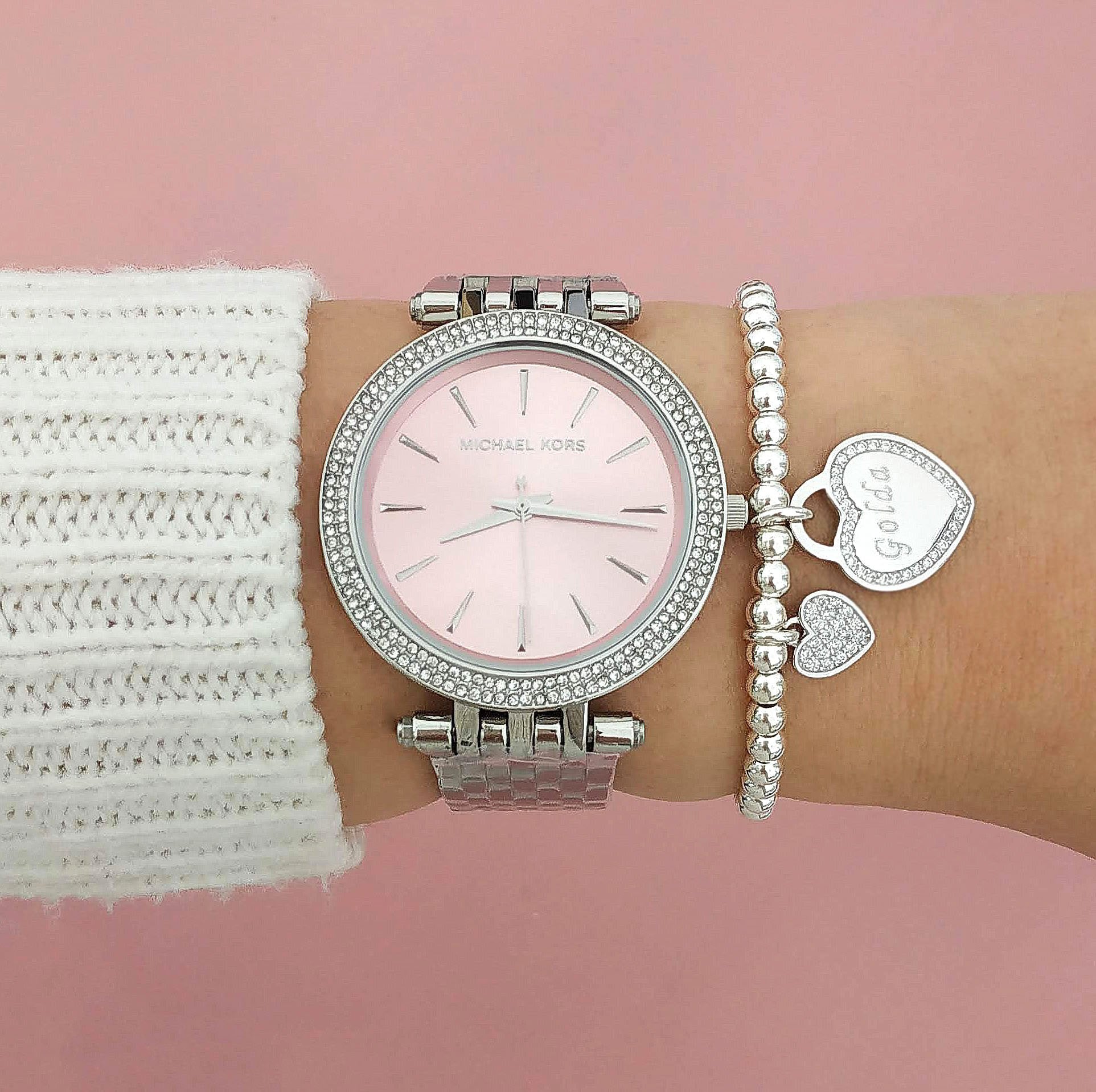 Michael Kors Darci MK3352 pink watch styled on wrist with accessories