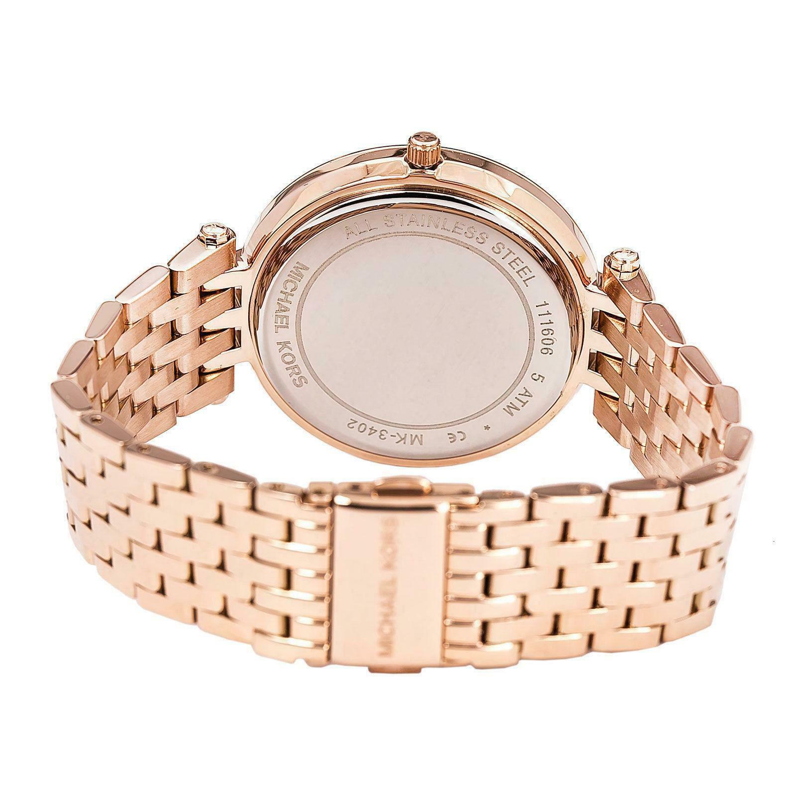 Rear caseback of Michael Kors Darci MK3402 watch with rose gold metal bracelet and engraved text
