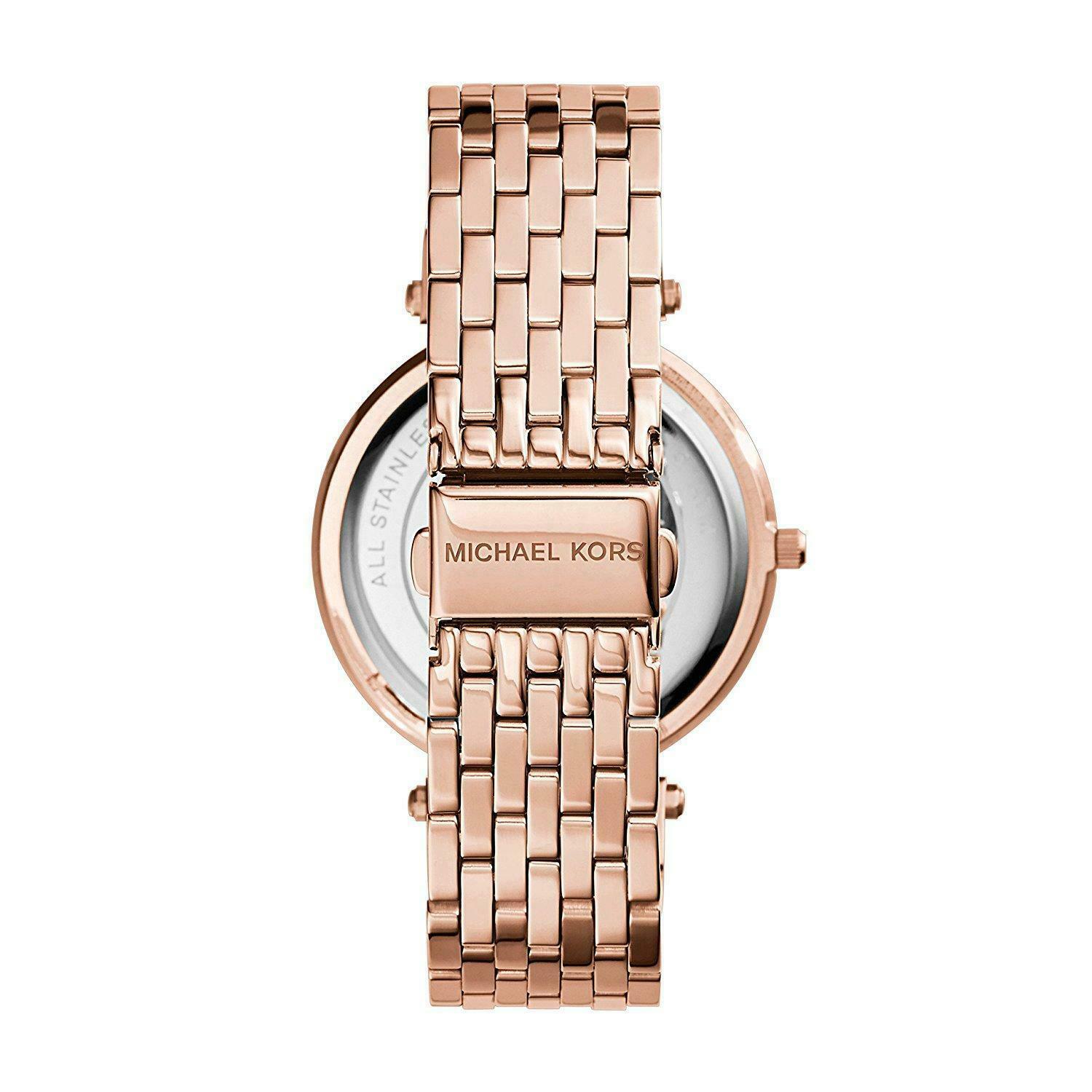Back view of Michael Kors Darci watch case showing transparent caseback and rose gold bracelet