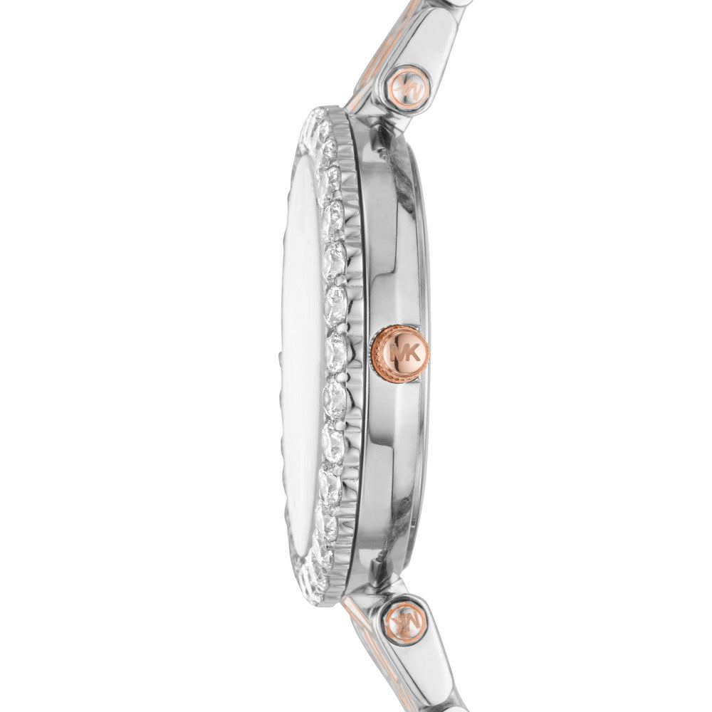 Side view of Michael Kors Darci watch showing crystal-adorned bezel and two-tone metal bracelet