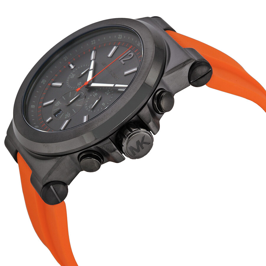 Michael Kors Dylan chronograph side angle view with orange rubber strap and gunmetal case