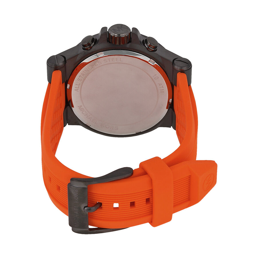 Michael Kors Dylan watch caseback showing orange rubber strap and gunmetal chronograph case