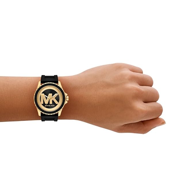 Michael Kors Everest watch on-wrist showing gold case and black silicone band
