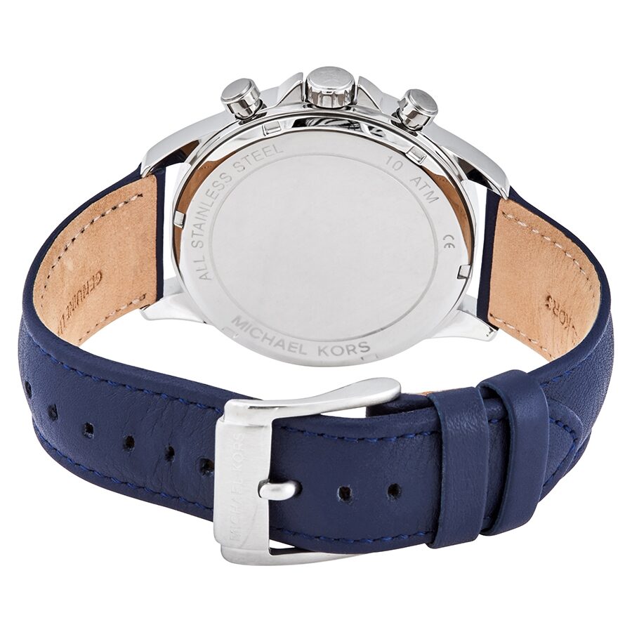 Michael Kors Gage watch caseback showing silver case and navy leather strap with tan lining