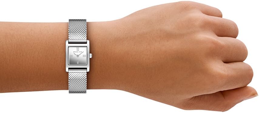 Michael Kors Georgie women's watch worn on wrist with silver mesh strap