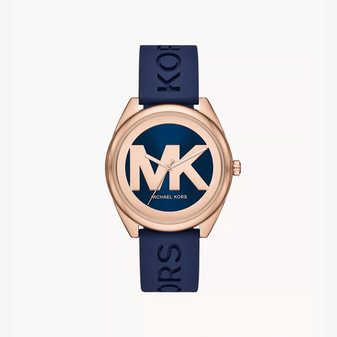 Michael Kors Janelle watch with rose gold case, blue dial with MK logo, and blue rubber strap