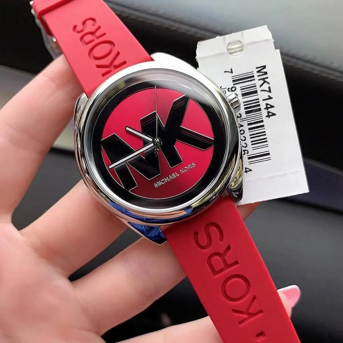 Michael Kors Janelle watch with product tag and serial number visible