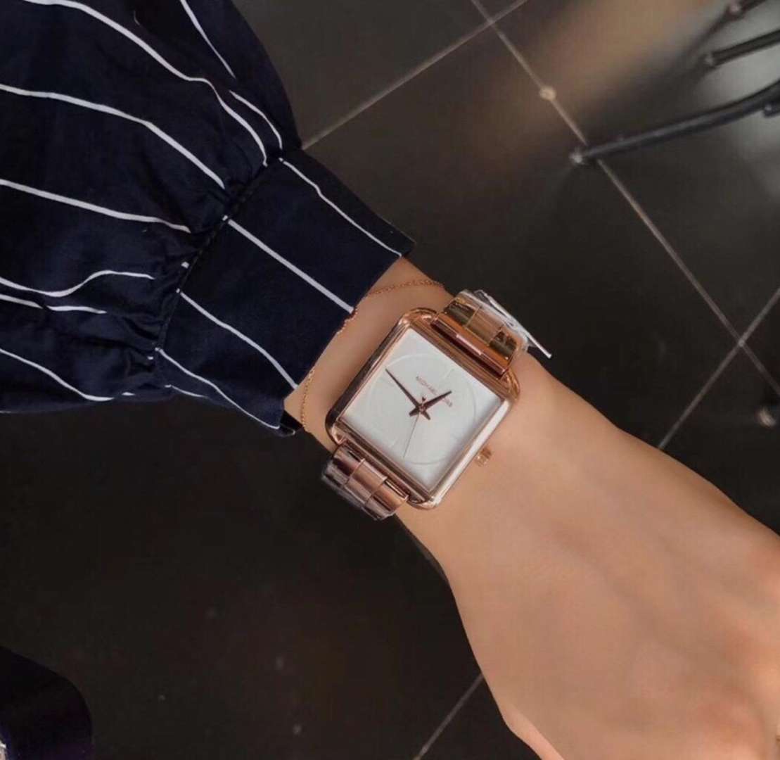 Michael Kors Lake MK3645 watch on wrist with white dial and rose gold-tone case