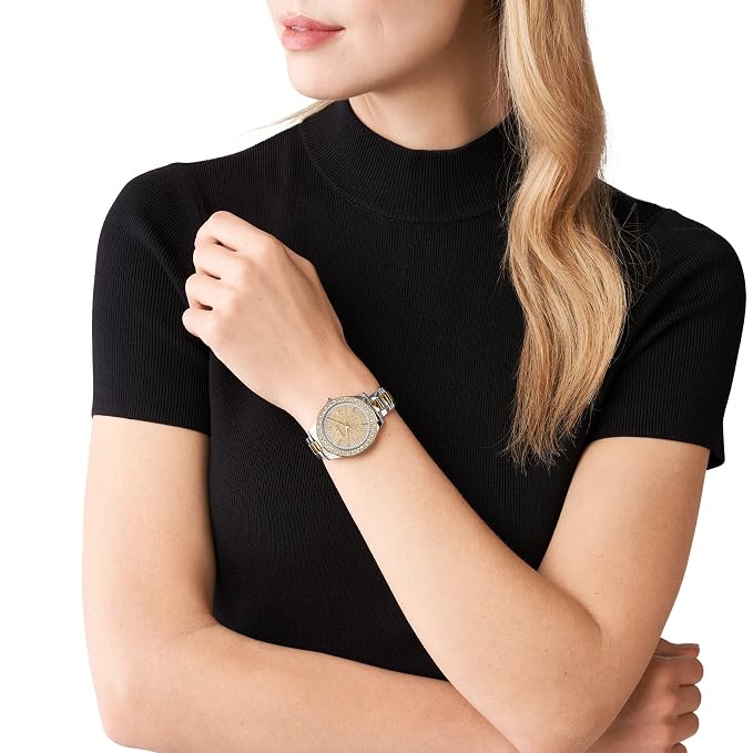 Michael Kors Liliane watch worn on wrist showing gold and silver two-tone design