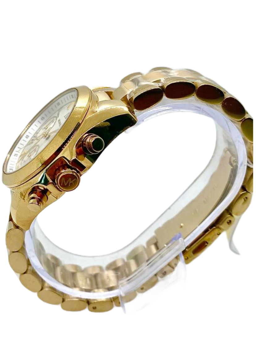 Michael Kors Mini Bradshaw watch side view showing gold-tone case and chronograph pushers