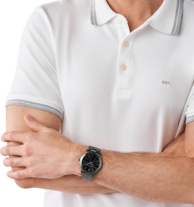 Michael Kors MK1044 Slim Runway watch worn on wrist with black dial and grey steel band