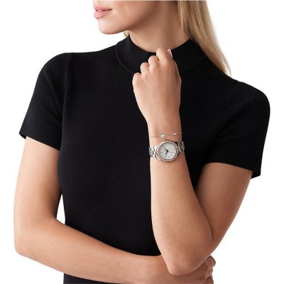 Michael Kors Liliane MK1048 watch worn on wrist with matching sterling silver bracelet