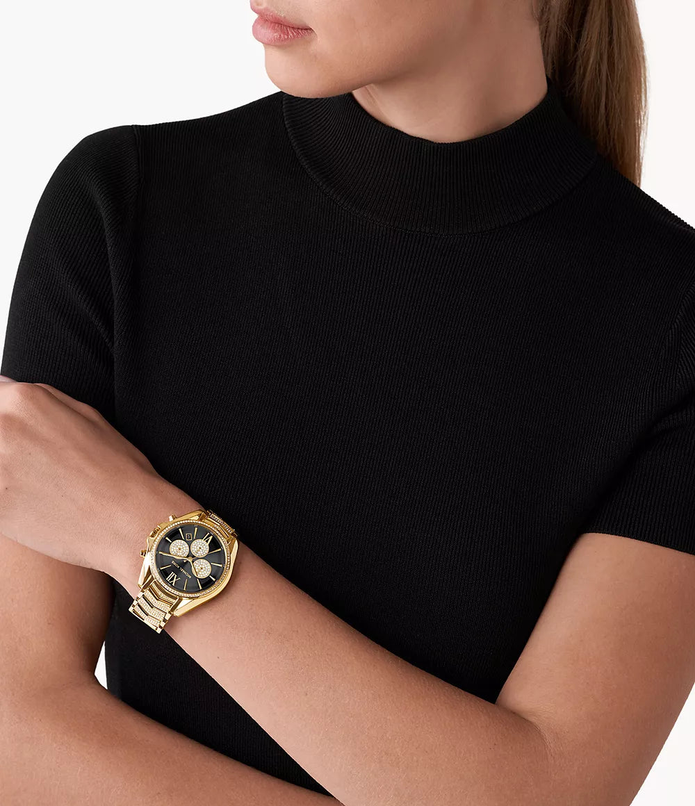 Michael Kors MK7224 gold watch worn on wrist with black dial