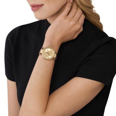 Michael Kors Parker MK2973 watch worn on wrist with brown leather strap and gold-tone case