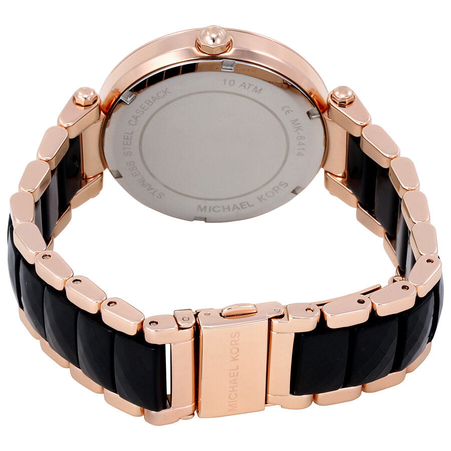Michael Kors Parker watch caseback showing engraved stainless steel back and two-tone bracelet