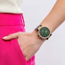Michael Kors Parker chronograph watch worn on wrist with green dial and green leather strap