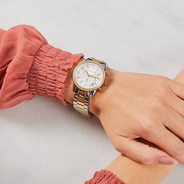 Michael Kors Ritz watch on wrist showing dial and two-tone silver-gold bracelet styling