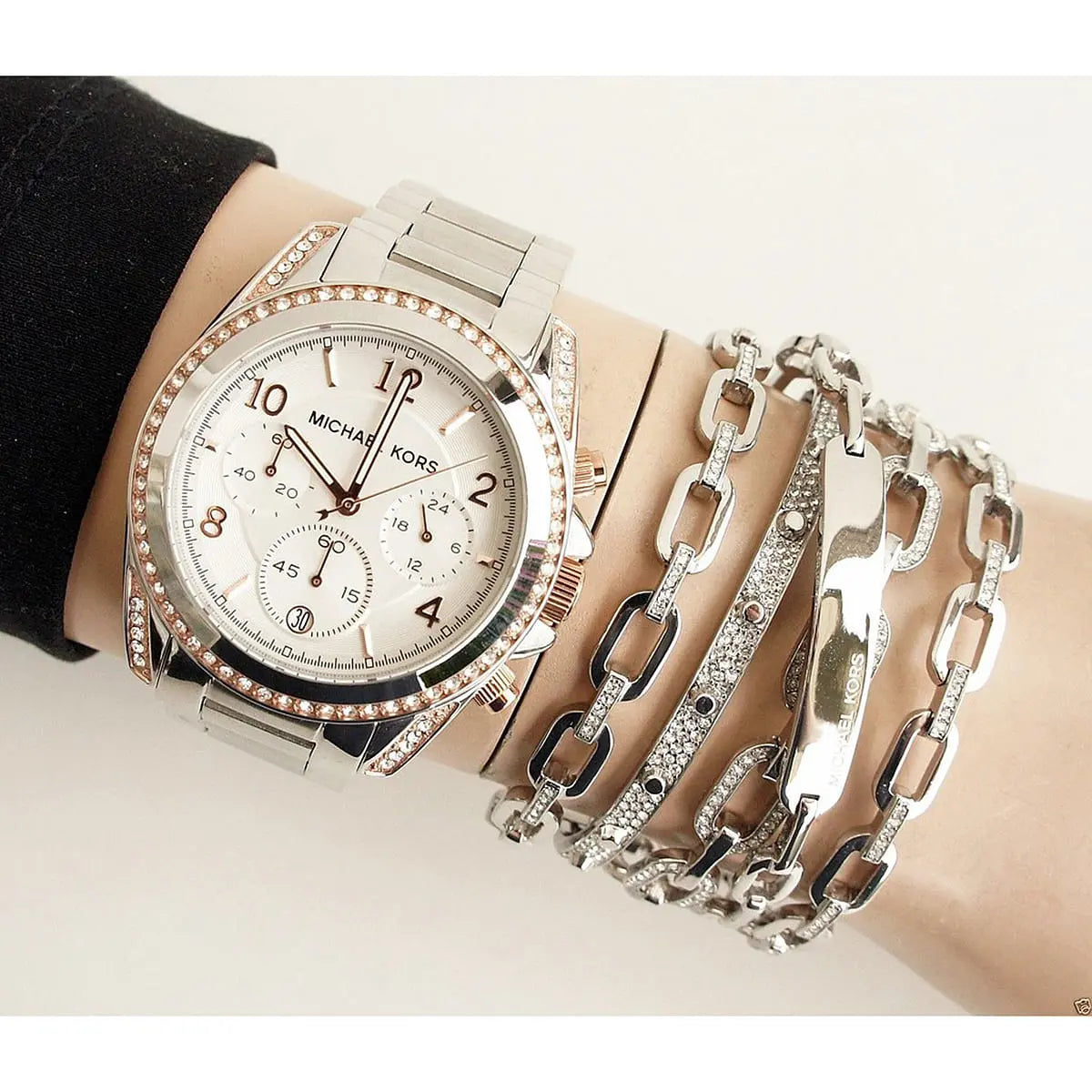 MK5459 chronograph watch styled on wrist with stainless steel bracelet and crystal bezel