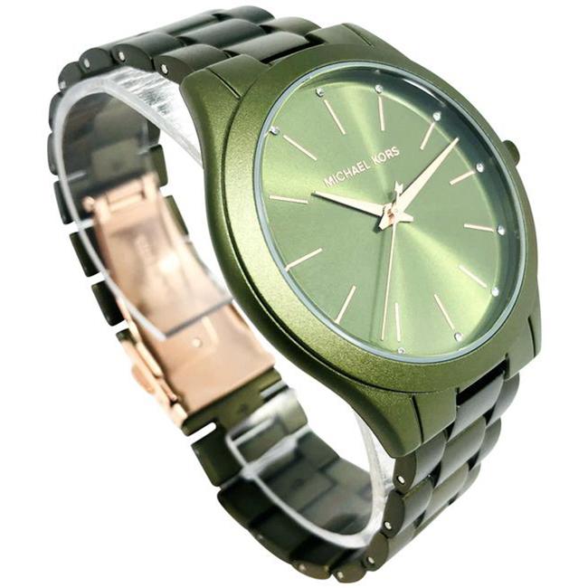 Side view of Michael Kors Slim Runway green women's watch showing green metal bracelet strap