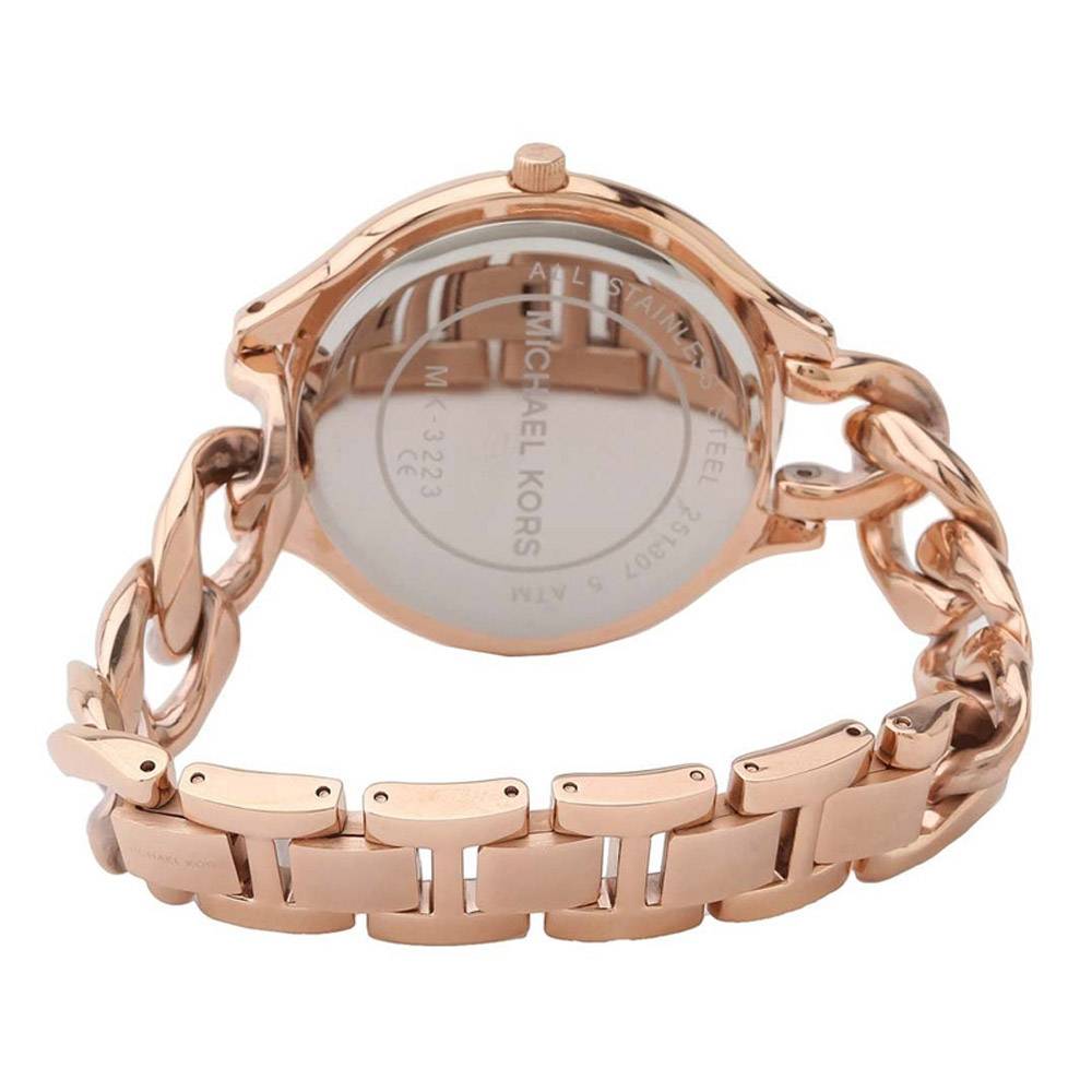 Caseback detail of Michael Kors Slim Runway Twist MK3223 watch with rose gold metal band