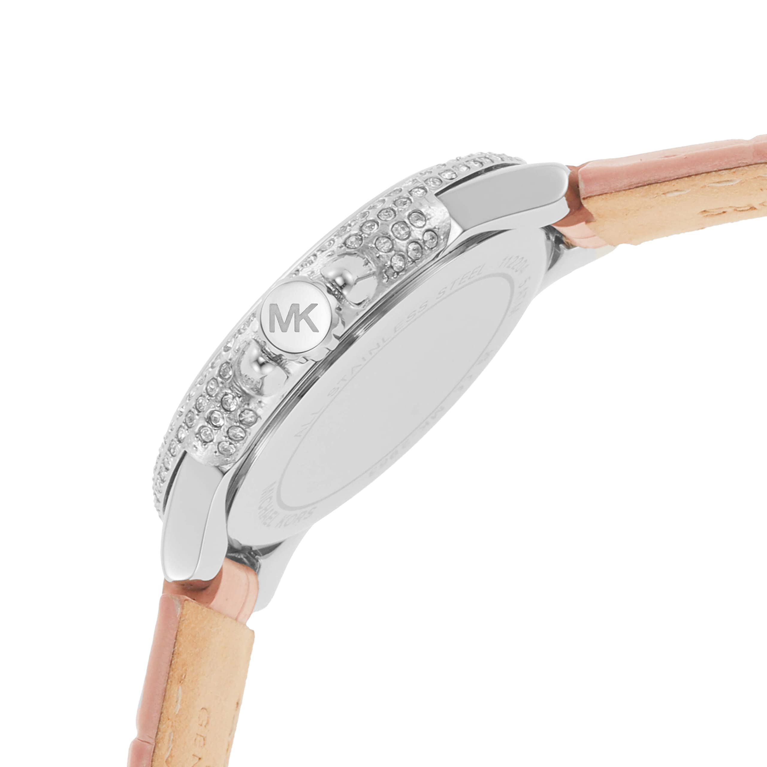 Three-quarter view of Michael Kors Camille watch with crystal bezel detail on pink leather strap