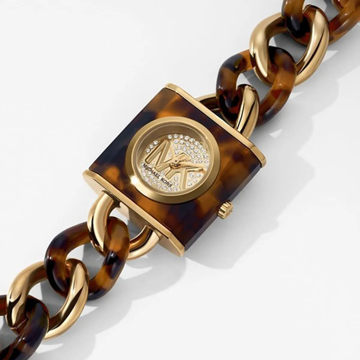 MK4808 watch dial detail showing tortoiseshell case with crystal-set MK logo