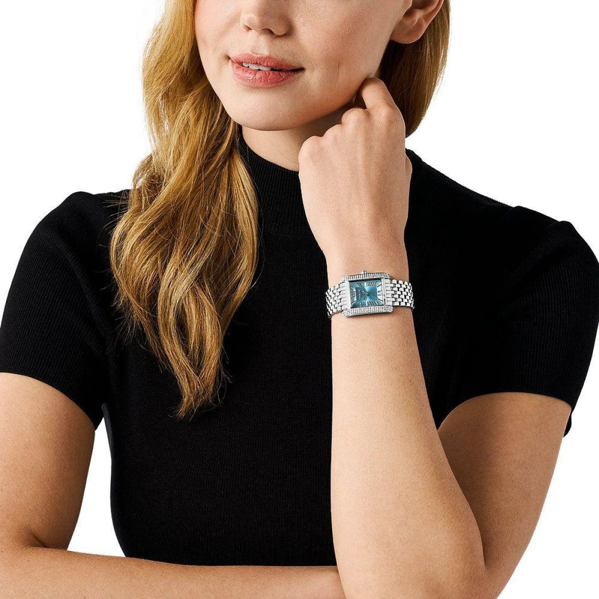 Michael Kors Emery silver-tone watch worn on wrist with turquoise dial visible