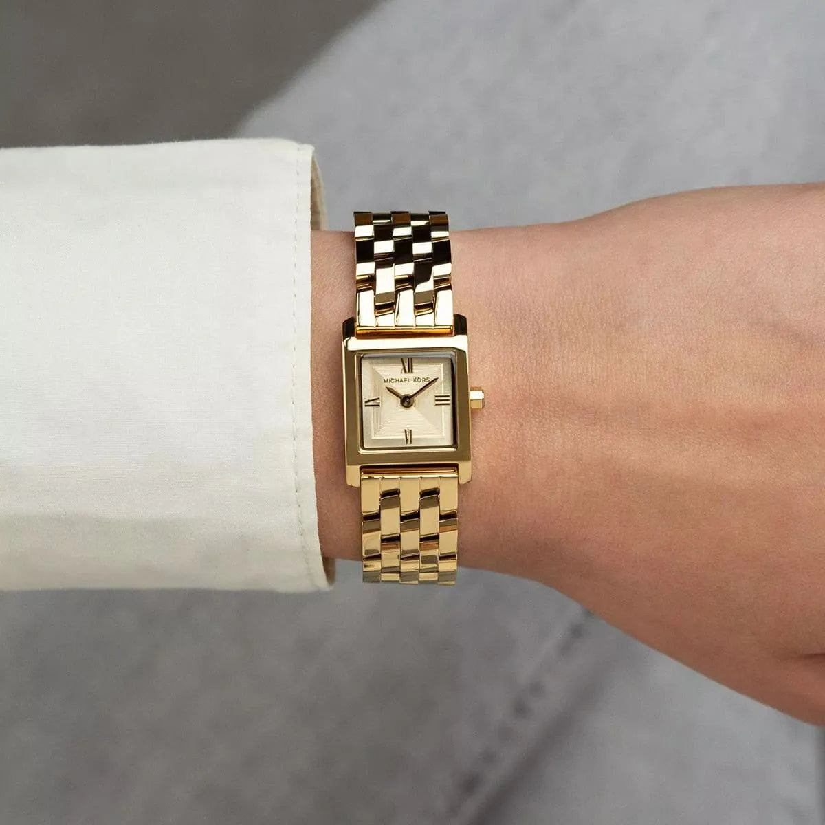 Gold stainless steel multi-link bracelet detail on Michael Kors Georgie watch