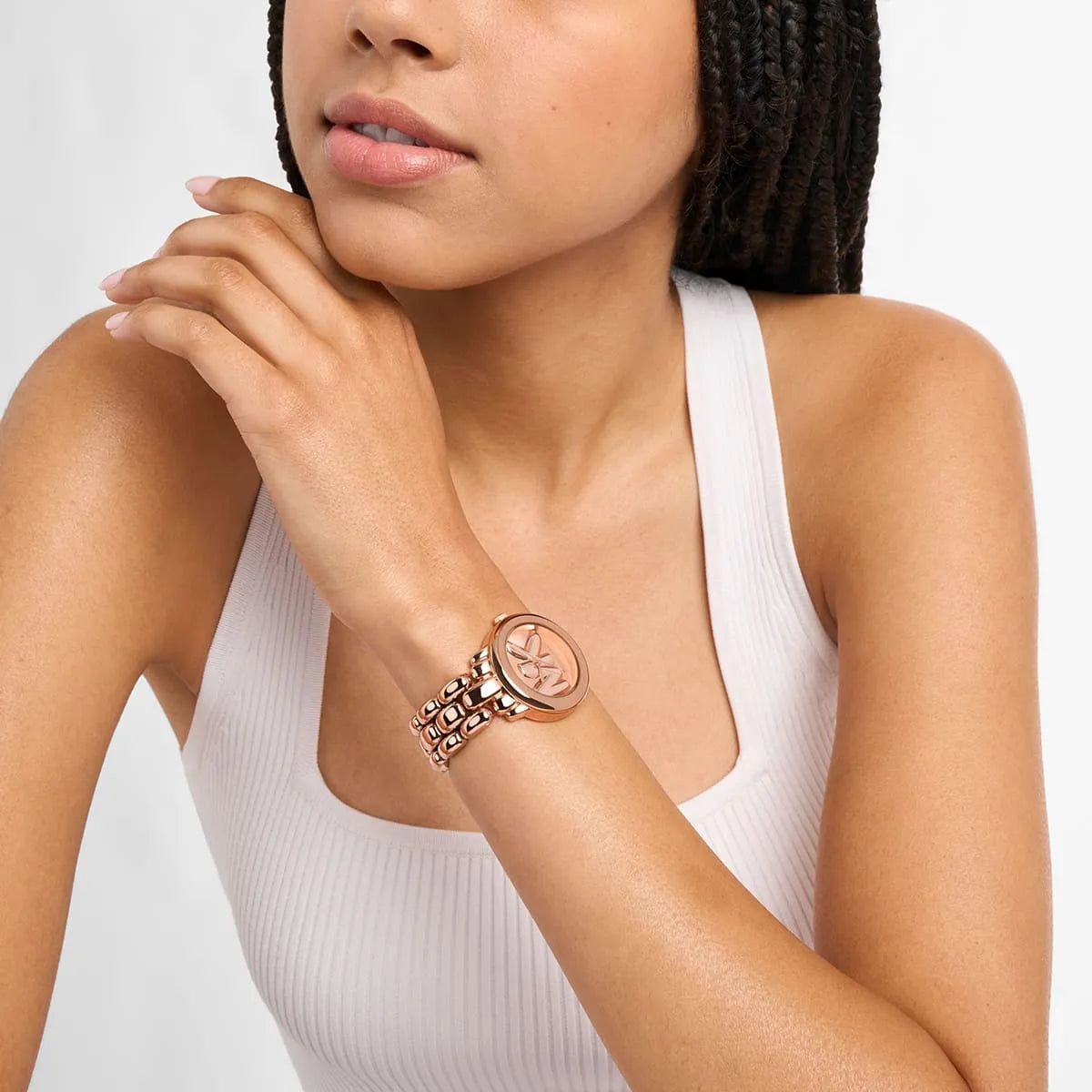 Michael Kors Phoebe women's rose gold watch worn on wrist with rose gold-tone stainless steel bracelet