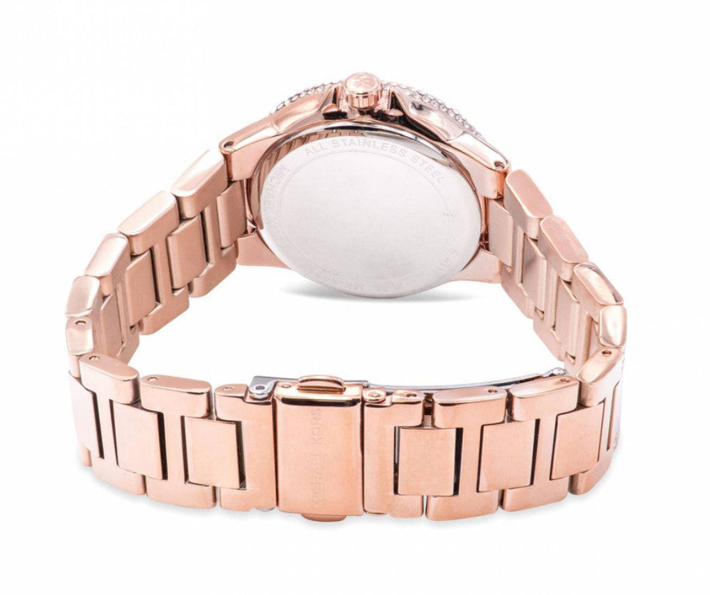 Caseback view of Michael Kors Mini Camille Pavé rose gold watch showing screw-down case back