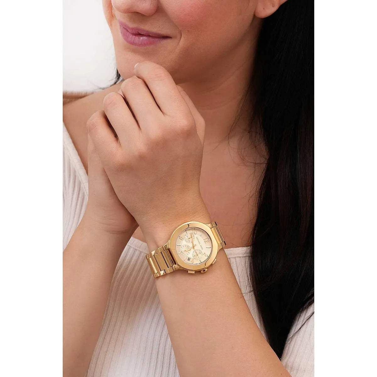 Michael Kors Gramercy gold chronograph watch worn on wrist