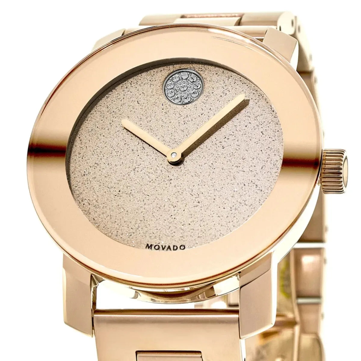 Movado Bold dial detail showing bronze sunburst finish with blue crystal accent