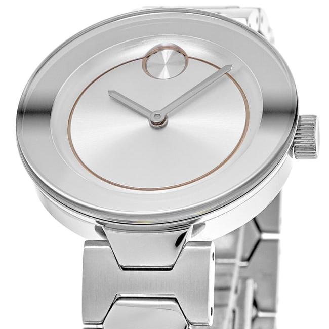 Movado Bold dial detail showing minimalist white face, iconic dot, and rose gold bezel ring