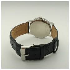 Movado Museum watch caseback showing black leather strap and chrome case