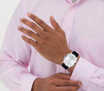 Movado TC Mirror Bezel watch worn on wrist with white dial and black leather strap