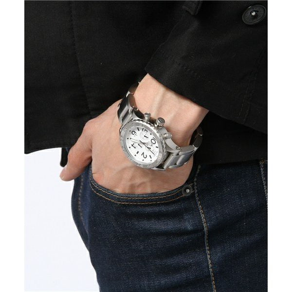 Nixon 42-20 Chrono watch worn on wrist with white dial and steel bracelet