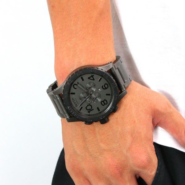 Nixon 51-30 chronograph watch worn on wrist with gunmetal dial
