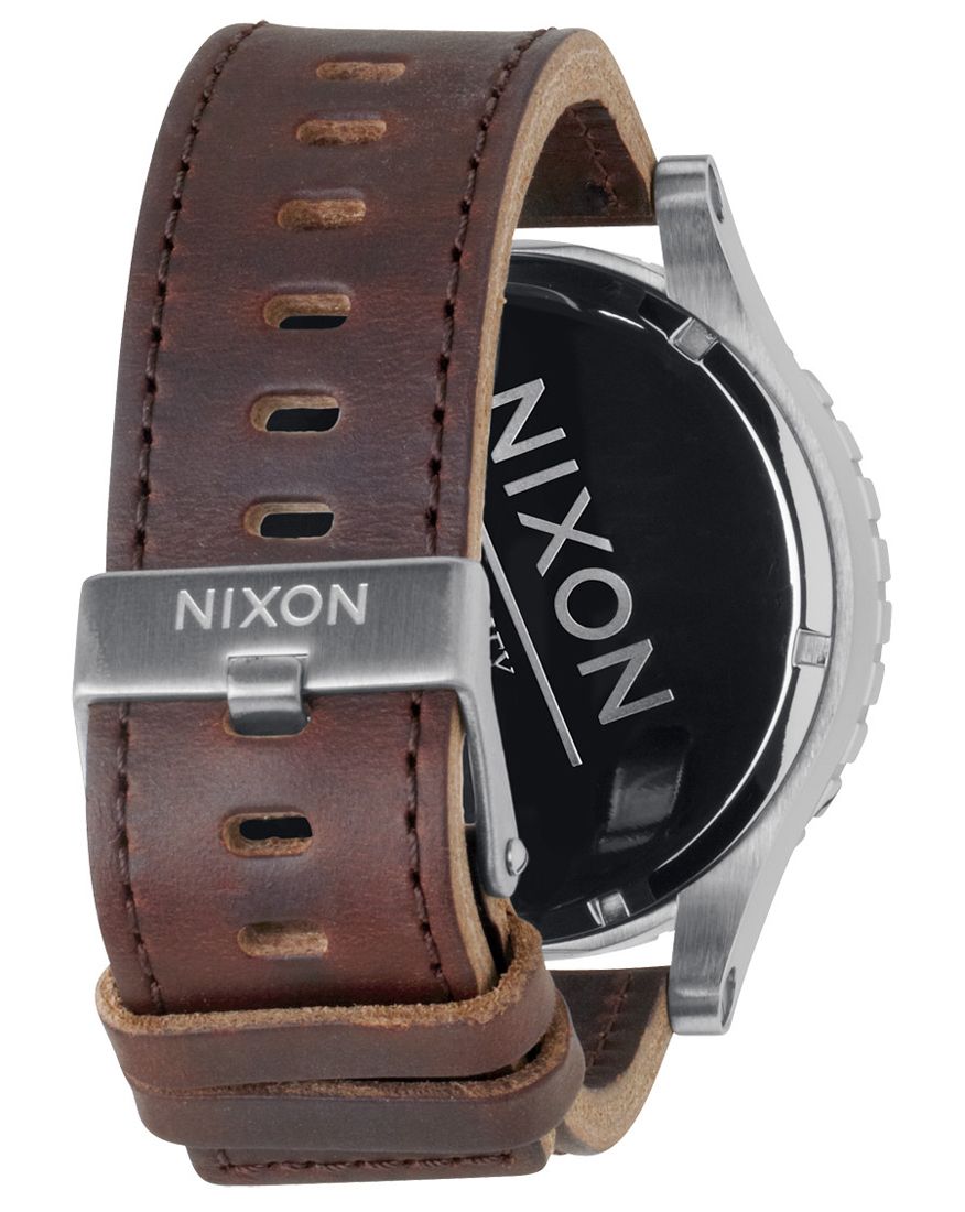 Nixon 51-30 caseback showing brown leather strap with metal keeper and Nixon branding