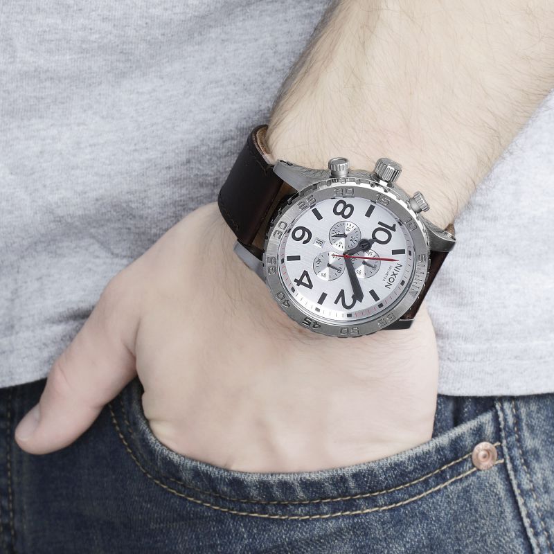 Nixon 51-30 chronograph watch worn on wrist with brown leather strap