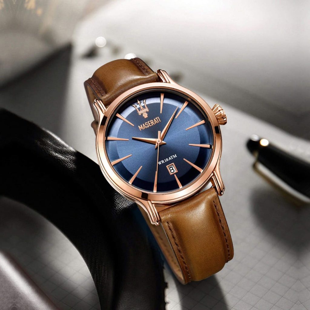 Maserati Epoca watch with blue dial and brown leather strap on desk