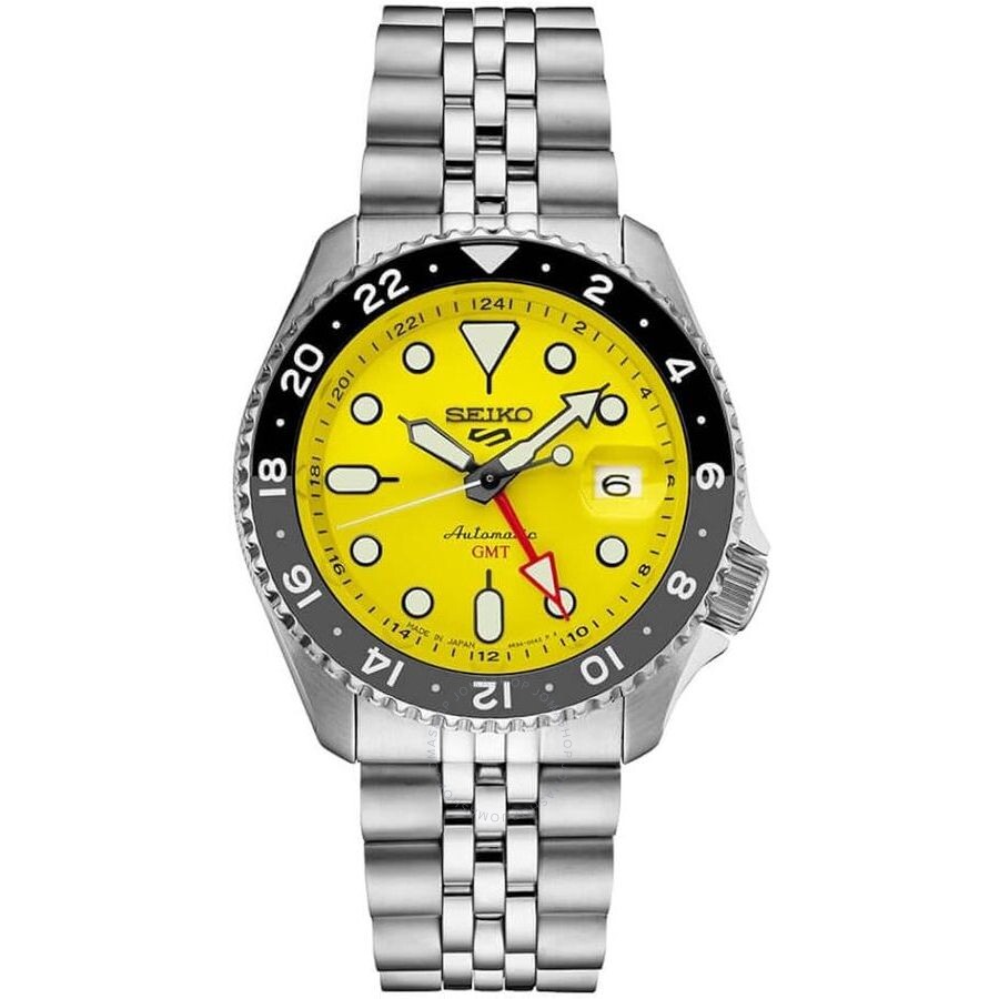 Seiko 5 GMT automatic watch with yellow dial and black bezel on stainless steel bracelet