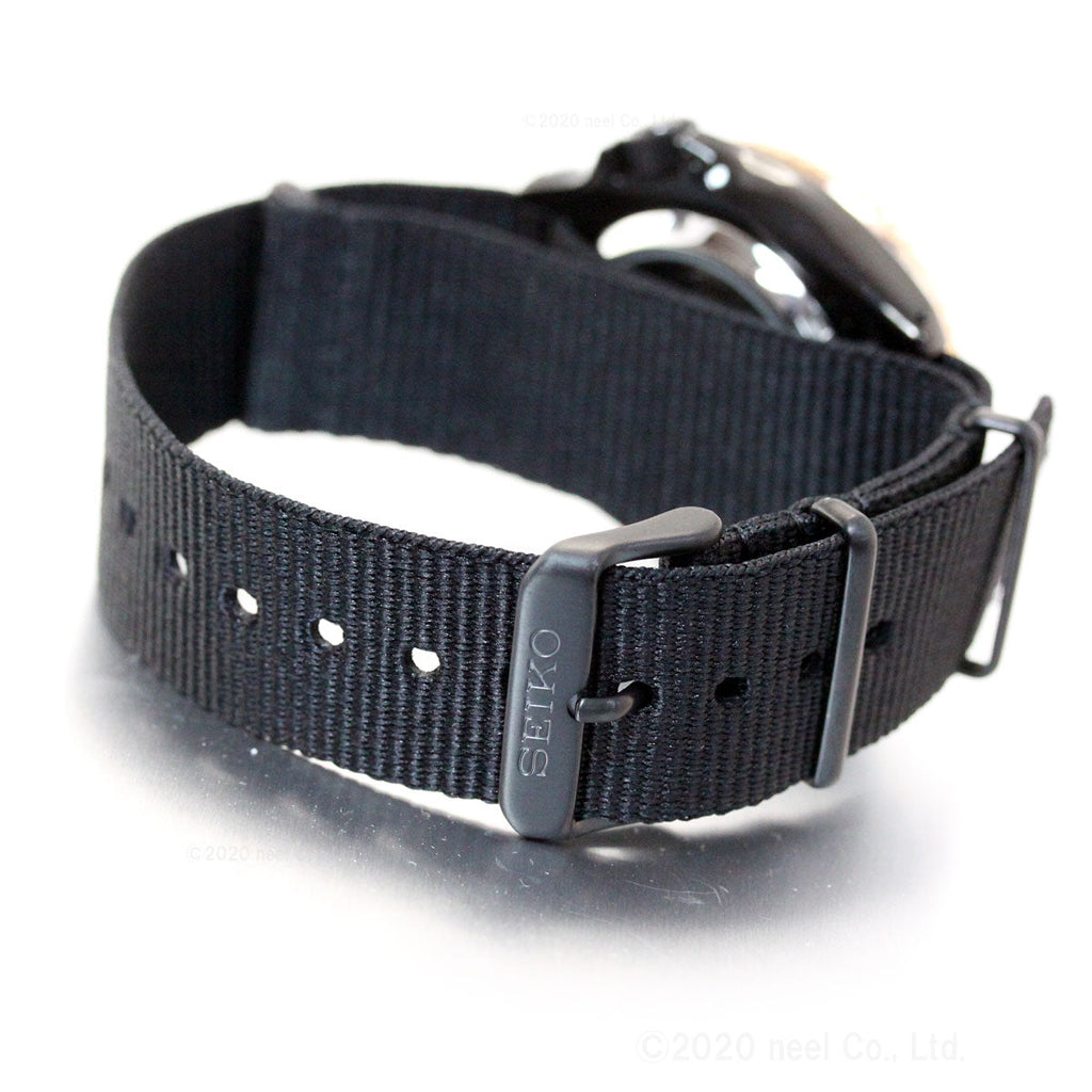 Seiko 5 Sports SBSA098 black fabric strap with metal buckle and SEIKO branding