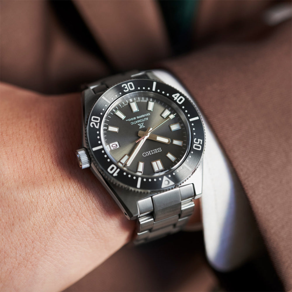 Seiko SPB143J1 automatic diver watch on wrist detail showing black dial and bezel