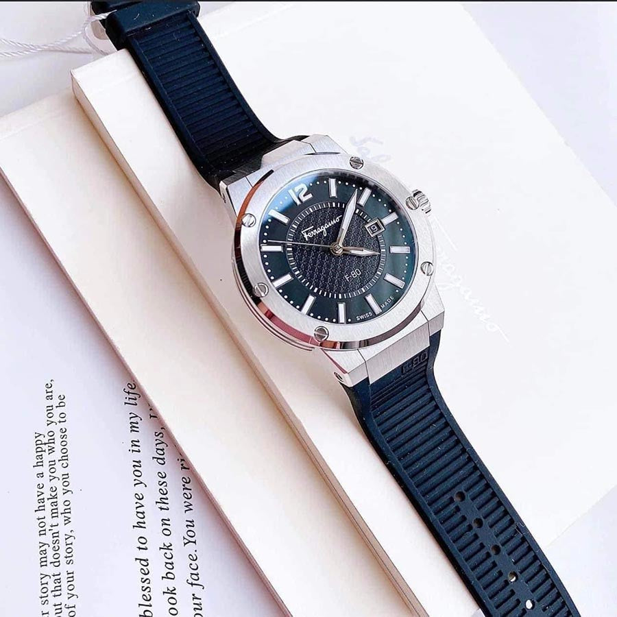 Ferragamo F-80 men's watch displayed on surface with black dial and blue rubber strap