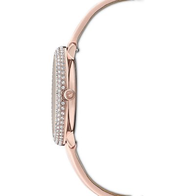 Swarovski women's watch side profile showing rose gold case with crystal-studded bezel and pink leather strap