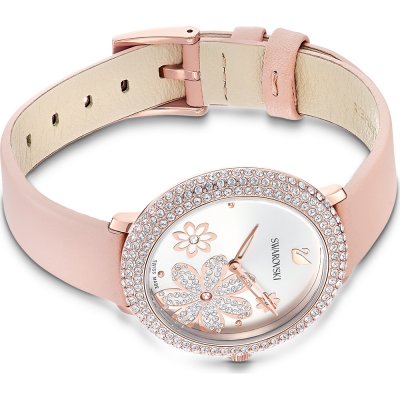 Swarovski women's watch showing dial face and pink leather strap with adjustable clasp detail