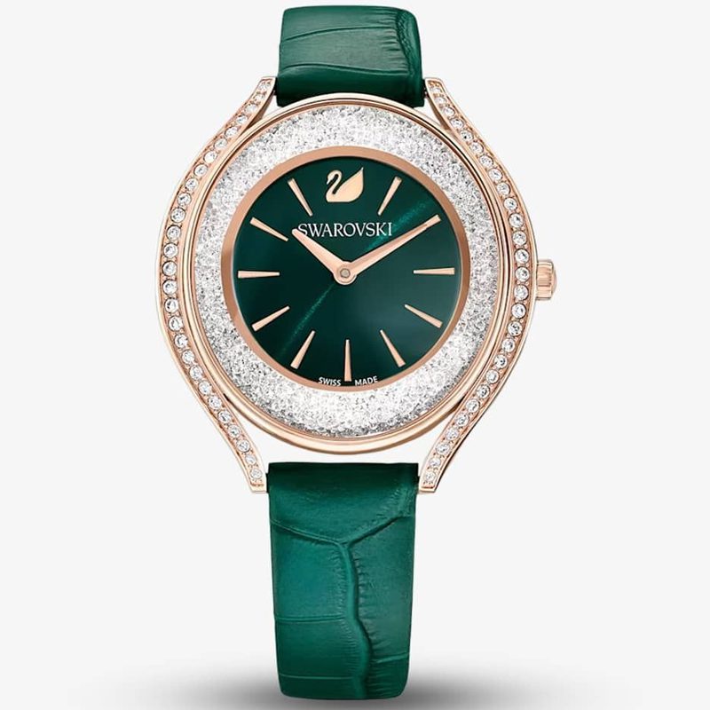 Swarovski Crystalline Aura women's watch with green dial, rose gold case with crystal bezel, and green leather strap