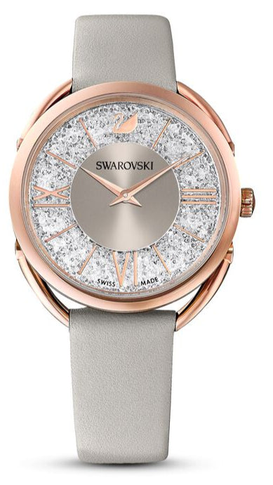Swarovski Crystalline Glam women's watch with rose gold case, silver dial, and grey leather strap