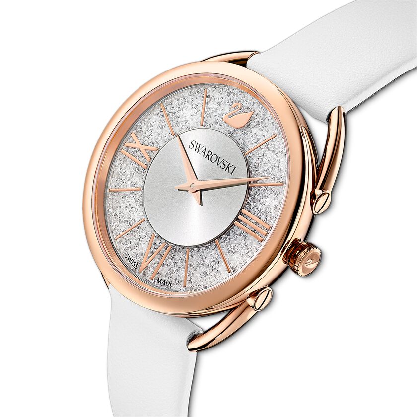 Crystalline Glam watch worn on wrist showing rose gold case with crystal-set dial and white strap