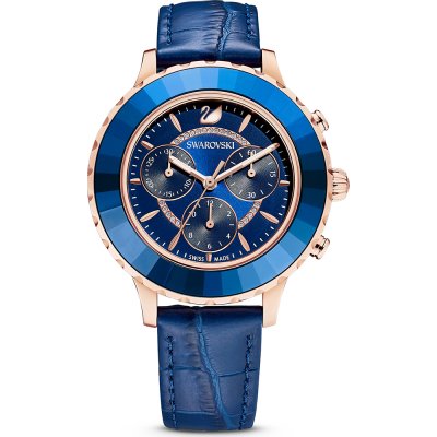 Swarovski Crystalline Glam women's watch with blue dial, rose gold case, and blue crystal bezel